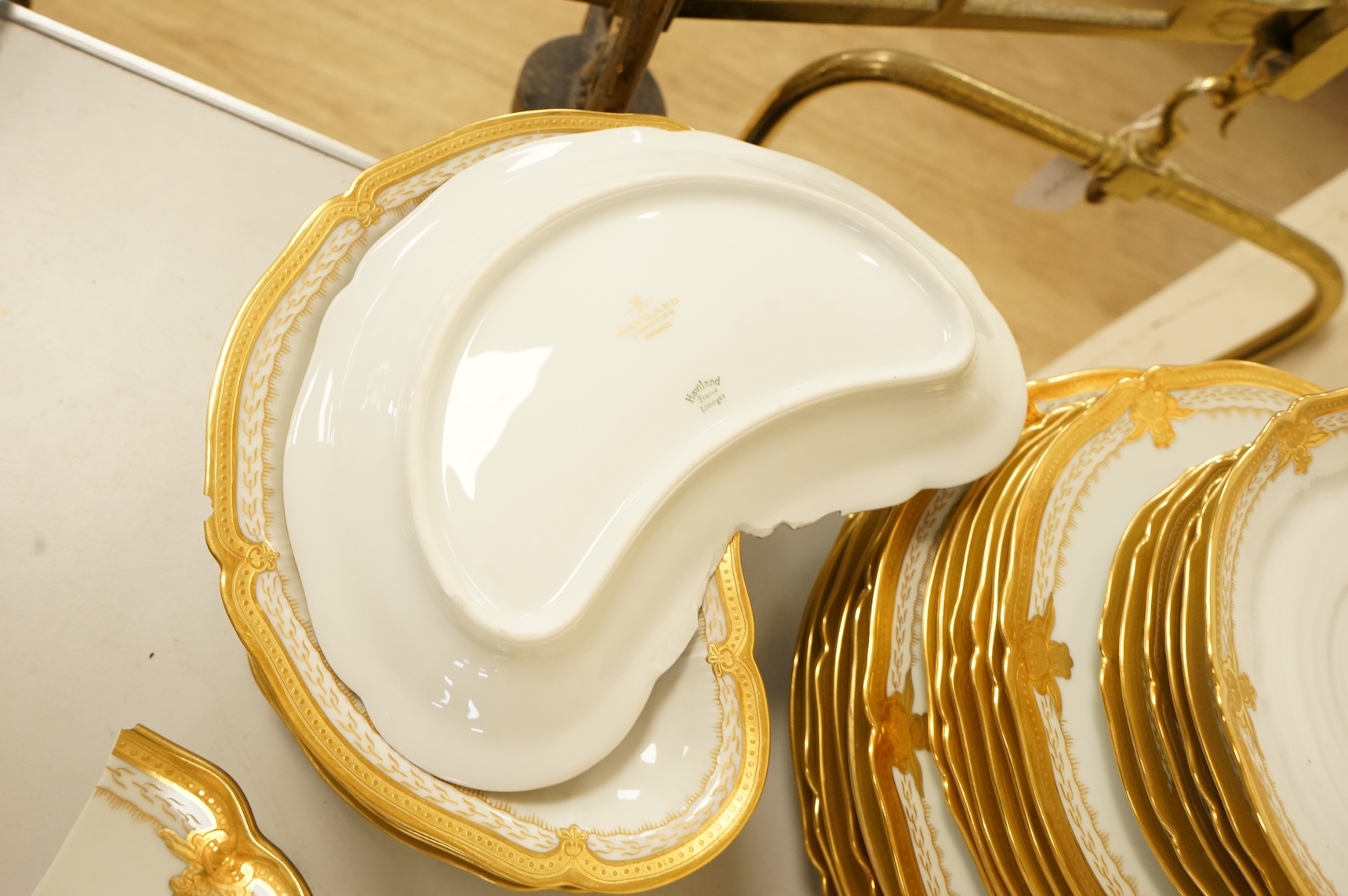A Haviland Limoges dinner service with gilt border